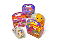 a set of cards and a box with a dinosaur in it
