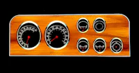 a wooden dashboard with various gauges on it