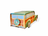 a wooden toy truck on a white background