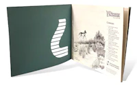 an open book with a drawing of a horse
