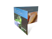 a folded brochure with a picture of a piece of cheese